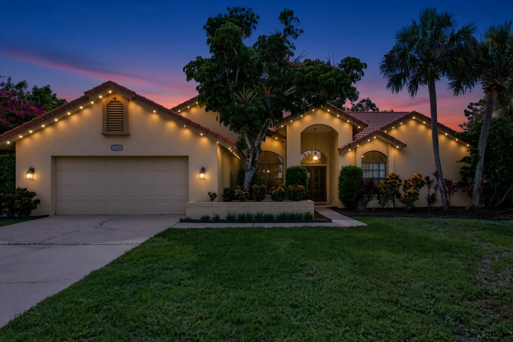 Permanent Christmas lights on a Clearwater Florida home — beautiful roofline glow at dusk, invisible by day
